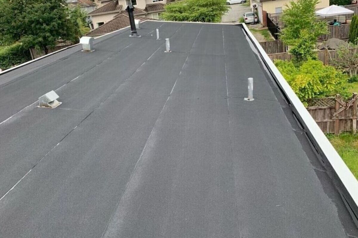 Black flat roof membrane installed on a residential building