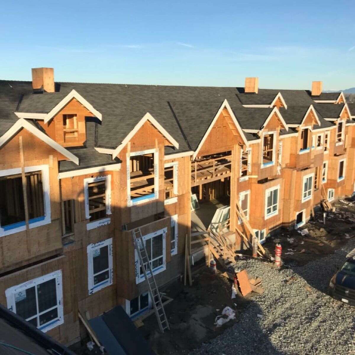 Dark asphalt shingle roof installed on a new multifamily strata building in Vancouver