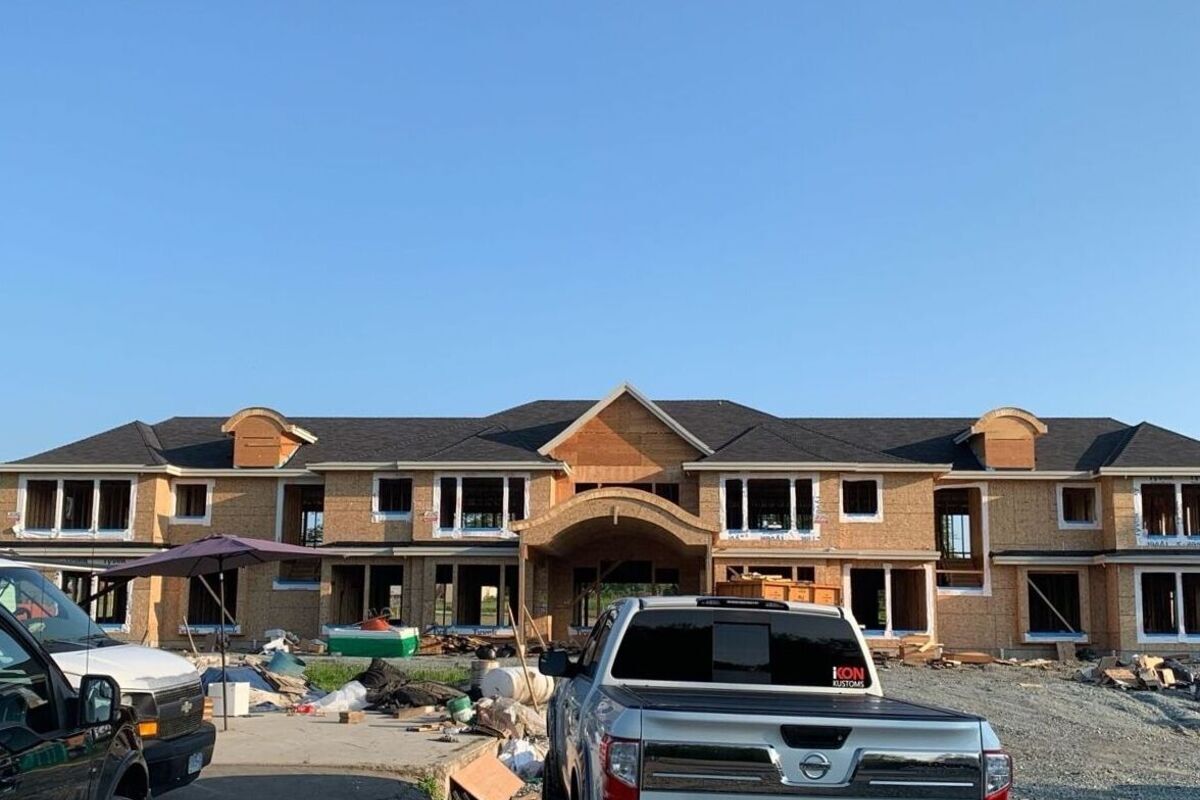 Dark asphalt shingles installed on a new multifamily residential building in Vancouver