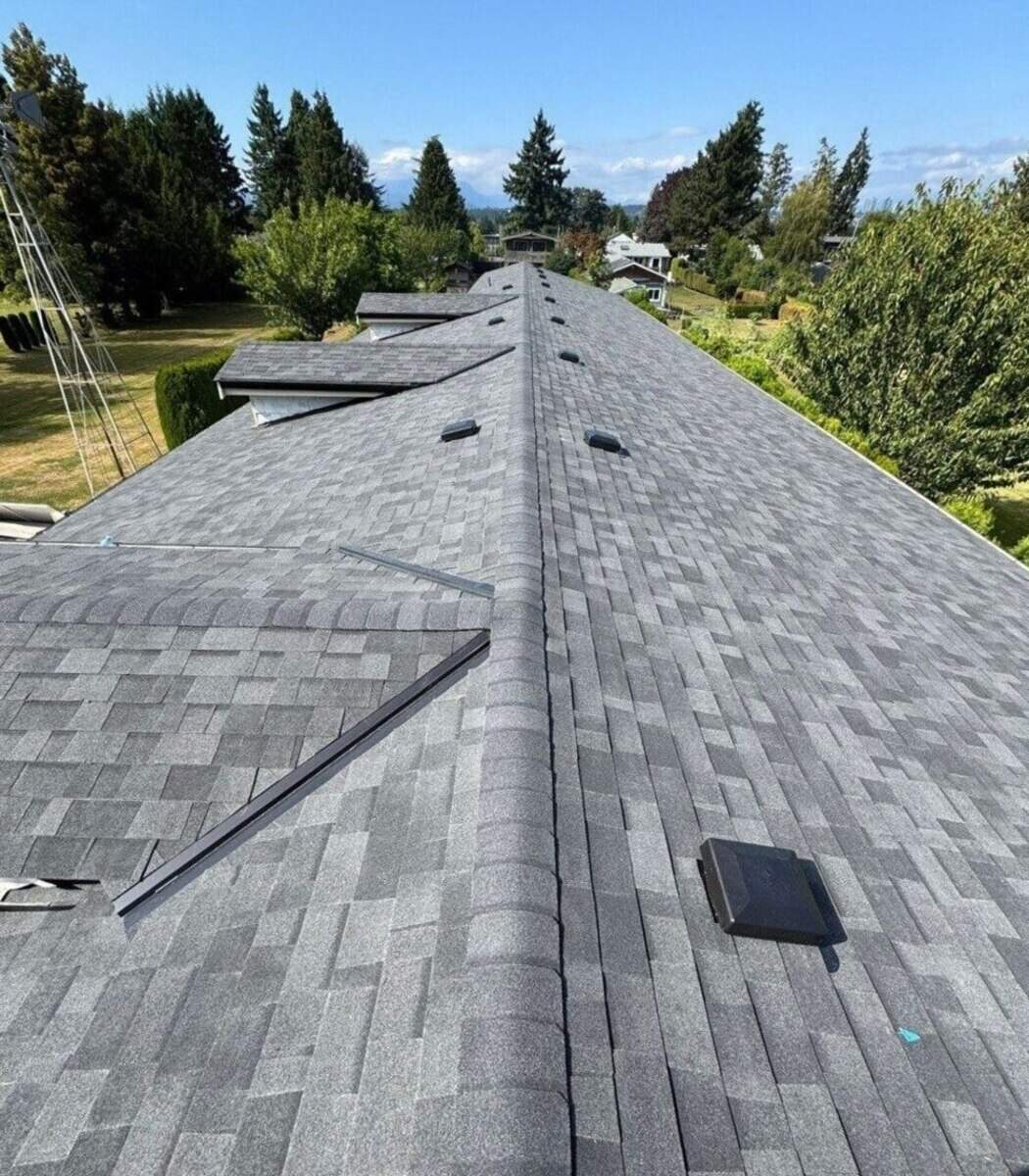 Marks Roofing completed this residential asphalt shingle roof with clean lines, ridge caps, and properly installed roof vents.